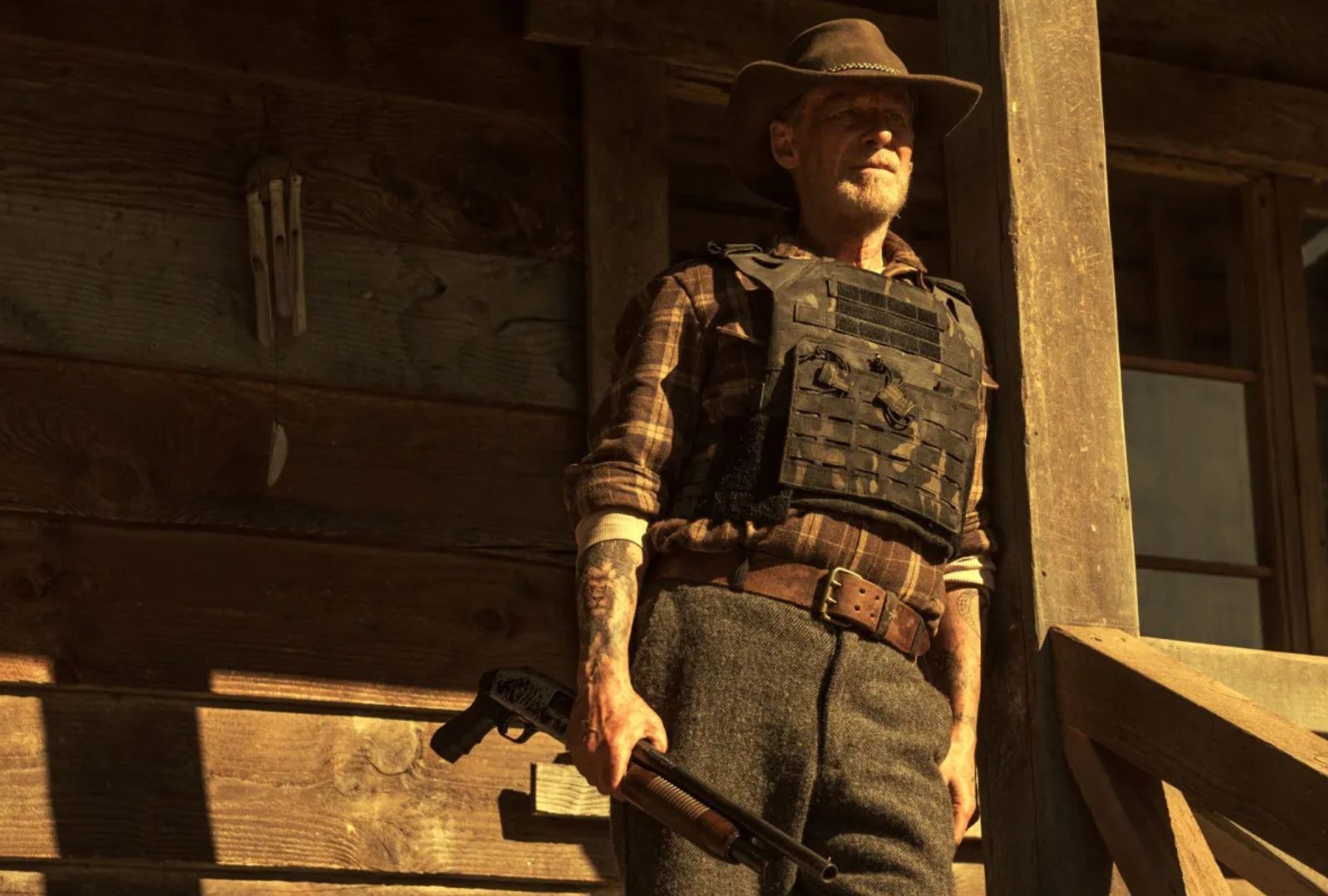 Richard Roxburgh as Otto in Forgive Us All. He wears a western outfit with a cowboy hat and gun.