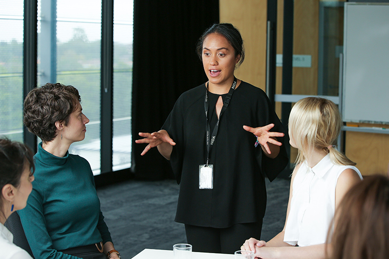 A woman speaking and a woman listening