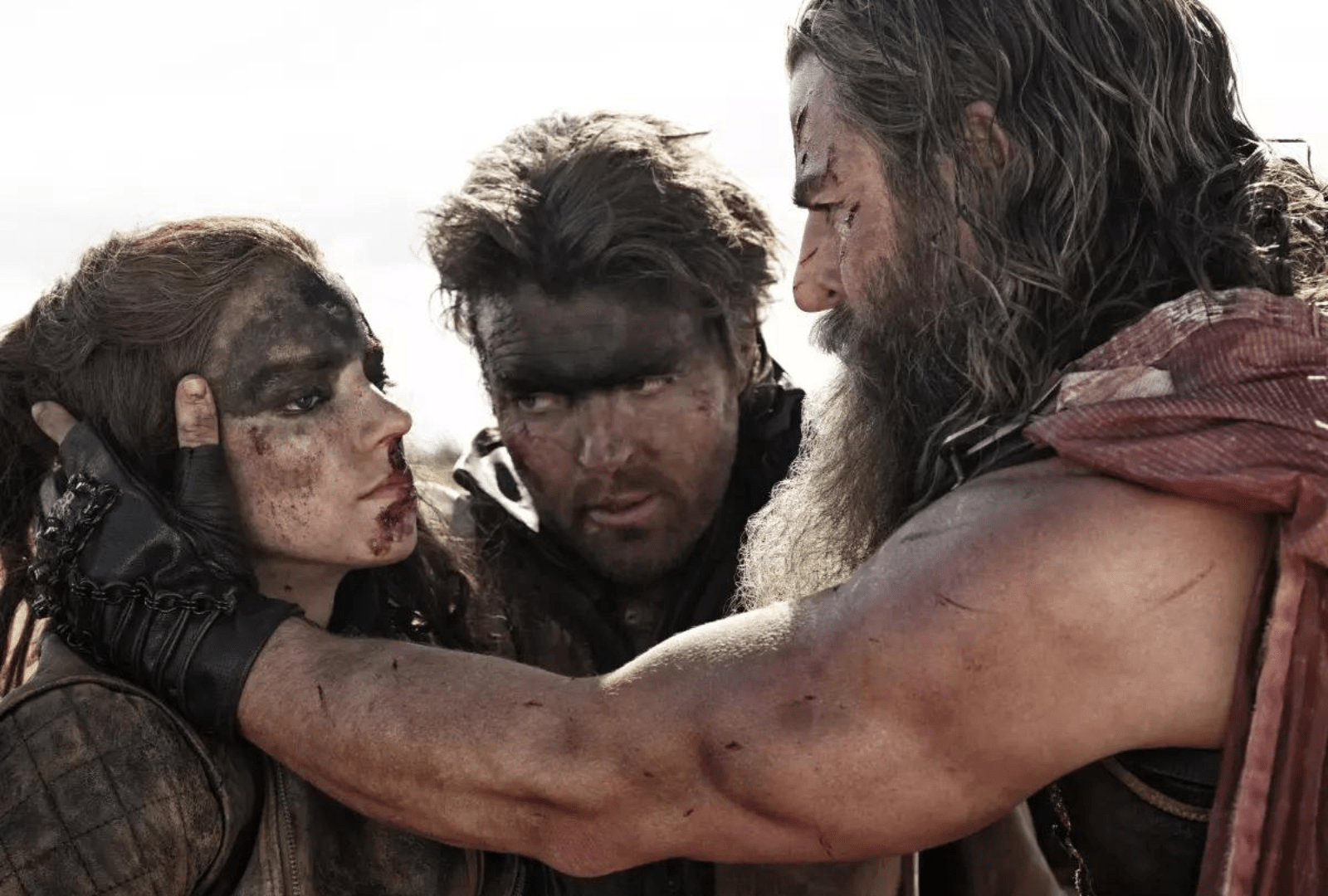 From left, Anya Taylor-Joy, Tom Burke and Chris Hemsworth in the movie “Furiosa: A Mad Max Saga.” (Jasin Boland / Warner Bros. Pictures)