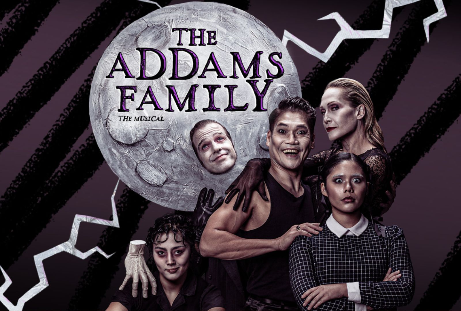 Five actors pose as The Addams Family in front of a moon. 