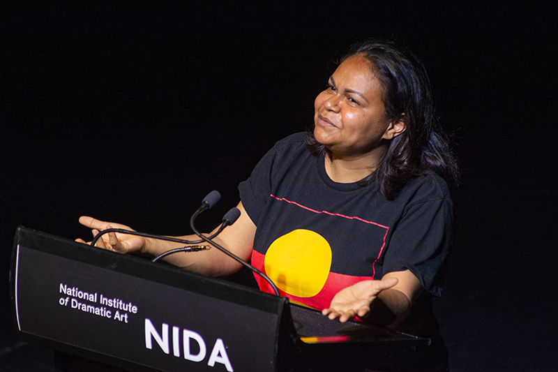 Ursula Yovich at lectern at NIDA